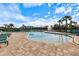 Community pool with lounge seating and shallow water access at 12518 Oak Hill Way, Parrish, FL 34219