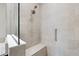 Modern shower with a built-in bench and sleek fixtures at 12518 Oak Hill Way, Parrish, FL 34219