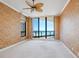 This primary bedroom features beach views, carpeted floor and a ceiling fan at 1281 Gulf Of Mexico Dr # 703, Longboat Key, FL 34228