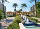 Water feature with palms in a courtyard setting, leading to the community building, with a resort-style appeal at 1281 Gulf Of Mexico Dr # 703, Longboat Key, FL 34228