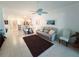 Open concept living space featuring a ceiling fan, tile floors and neutral decor at 13602 Abercrombie Dr, Englewood, FL 34223