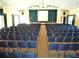 Community auditorium with ample seating and elevated stage area at 1531 Clower Creek Dr # Ha245, Sarasota, FL 34231