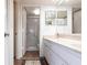 Bright bathroom with dual sinks, marble countertops, and a walk-in shower at 1531 Clower Creek Dr # Ha245, Sarasota, FL 34231