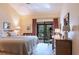 Light and bright bedroom with access to outdoor patio and attached bath at 1531 Clower Creek Dr # Ha245, Sarasota, FL 34231