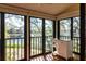 Enclosed porch with tiled floors and sliding windows with relaxing water views at 1531 Clower Creek Dr # Ha245, Sarasota, FL 34231