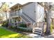 Charming condo exterior featuring a private entrance, wood accents, and well-maintained landscaping at 1531 Clower Creek Dr # Ha245, Sarasota, FL 34231