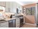 Well-equipped kitchen featuring stainless steel appliances, granite countertops, and stylish backsplash at 1531 Clower Creek Dr # Ha245, Sarasota, FL 34231