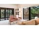 Relaxing living room features sliding glass doors with views of the water at 1531 Clower Creek Dr # Ha245, Sarasota, FL 34231