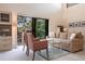 Bright living room with neutral tones, comfortable seating, and balcony access at 1531 Clower Creek Dr # Ha245, Sarasota, FL 34231