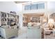 Open-concept living room featuring built-in shelving, a high ceiling, and stylish furnishings at 1531 Clower Creek Dr # Ha245, Sarasota, FL 34231