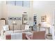 Spacious living room with soaring ceilings and natural light from many windows at 1531 Clower Creek Dr # Ha245, Sarasota, FL 34231
