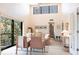 Living room with high ceilings, comfortable seating and a sliding door to the balcony at 1531 Clower Creek Dr # Ha245, Sarasota, FL 34231