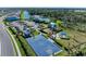 Aerial view of the community amenities showing a swimming pool, clubhouse, basketball court and playground at 16438 Slate Pl, Lakewood Ranch, FL 34211