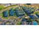 Aerial view of the tennis courts, clubhouse, and pool in the Del Webb community of Lakewood Ranch at 17026 Loudon Pl, Bradenton, FL 34202