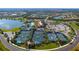 Del Webb Lakewood Ranch aerial showcasing tennis courts, clubhouse, and pool, all near a scenic lake at 17026 Loudon Pl, Bradenton, FL 34202