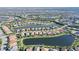 Captivating aerial shot displaying a lakeside neighborhood with well-maintained homes and green spaces at 17026 Loudon Pl, Bradenton, FL 34202