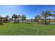Spacious waterfront backyard boasting a well-manicured lawn and scenic pond views at 17026 Loudon Pl, Bradenton, FL 34202