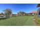 Scenic backyard view with lush green lawn and tranquil lake, creating a peaceful outdoor oasis at 17026 Loudon Pl, Bradenton, FL 34202