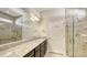 Modern bathroom featuring sleek fixtures, granite countertops, and a glass-enclosed shower at 17026 Loudon Pl, Bradenton, FL 34202