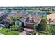 Charming single-Gathering home with a tile roof, two car garage, and verdant landscaping, backing onto a tranquil lake at 17026 Loudon Pl, Bradenton, FL 34202