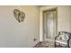 Elegant front entrance featuring a decorative glass door, leafy wall art, and cozy seating at 17026 Loudon Pl, Bradenton, FL 34202