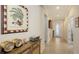 Inviting hallway with elegant tile flooring, decorative art, and a bright front door, creating a welcoming ambiance at 17026 Loudon Pl, Bradenton, FL 34202