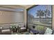 Relaxing screened lanai with comfortable seating and serene lake views, perfect for enjoying the outdoors in comfort at 17026 Loudon Pl, Bradenton, FL 34202