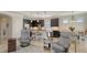 Open concept space featuring an island with pendant lights, stainless appliances and a cozy dining nook at 17026 Loudon Pl, Bradenton, FL 34202