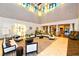 Inviting lobby with comfortable seating, columns, high ceilings, and ample natural light at 17026 Loudon Pl, Bradenton, FL 34202