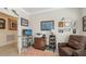 Office featuring a comfortable chair, mounted TV, unique decor, and natural light at 17026 Loudon Pl, Bradenton, FL 34202