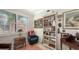 Cozy office featuring a built-in bookcase, natural light, and comfortable seating at 17026 Loudon Pl, Bradenton, FL 34202