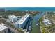 Aerial view of a waterfront condominium complex with boat docks and neighborhood views at 1709 N Tamiami Trl # 408, Sarasota, FL 34234