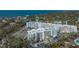 Aerial view of the waterfront condos with parking areas and manicured landscaping at 1709 N Tamiami Trl # 408, Sarasota, FL 34234