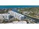 Aerial view of waterfront condos with boat docks on a beautiful day at 1709 N Tamiami Trl # 408, Sarasota, FL 34234
