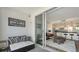 Balcony leading to modern living room and kitchen with island seating at 1709 N Tamiami Trl # 408, Sarasota, FL 34234