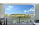 Balcony overlooking the water with boat docks and waterfront homes in the distance at 1709 N Tamiami Trl # 408, Sarasota, FL 34234