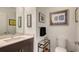Bathroom featuring a wood vanity, quartz countertop, and modern fixtures at 1709 N Tamiami Trl # 408, Sarasota, FL 34234