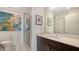 Modern bathroom with a glass-enclosed shower, quartz countertop and stylish fixtures at 1709 N Tamiami Trl # 408, Sarasota, FL 34234
