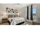 Serene bedroom featuring modern art, neutral tones, and a ceiling fan at 1709 N Tamiami Trl # 408, Sarasota, FL 34234