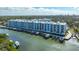 Modern condo building on the water with boat docks and beautiful landscaping at 1709 N Tamiami Trl # 408, Sarasota, FL 34234