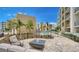 Relaxing outdoor firepit area with comfortable seating and modern landscaping at 1709 N Tamiami Trl # 408, Sarasota, FL 34234