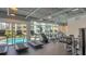 Well-lit gym featuring treadmills, ellipticals and a pool view at 1709 N Tamiami Trl # 408, Sarasota, FL 34234