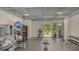 Bright gym with a variety of exercise equipment including weights and benches at 1709 N Tamiami Trl # 408, Sarasota, FL 34234