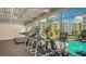 Well-equipped gym with treadmills and elliptical machines overlooking the pool at 1709 N Tamiami Trl # 408, Sarasota, FL 34234