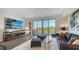 Cozy living room with access to a private balcony and comfortable seating arrangements at 1709 N Tamiami Trl # 408, Sarasota, FL 34234