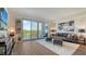 Inviting living area with balcony, plush seating, and stylish decor for a relaxed atmosphere at 1709 N Tamiami Trl # 408, Sarasota, FL 34234
