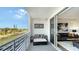 Living room with a balcony overlooking the water, providing a seamless indoor-outdoor living experience at 1709 N Tamiami Trl # 408, Sarasota, FL 34234