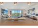 Bright and airy living room featuring a large sectional sofa and stunning outside views at 1709 N Tamiami Trl # 408, Sarasota, FL 34234