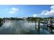 Scenic waterfront view featuring boat docks, boats, and luxury homes in the distance at 1709 N Tamiami Trl # 408, Sarasota, FL 34234