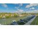 A gorgeous waterfront property with boat docks in a scenic canal setting under a beautiful blue sky at 1709 N Tamiami Trl # 408, Sarasota, FL 34234